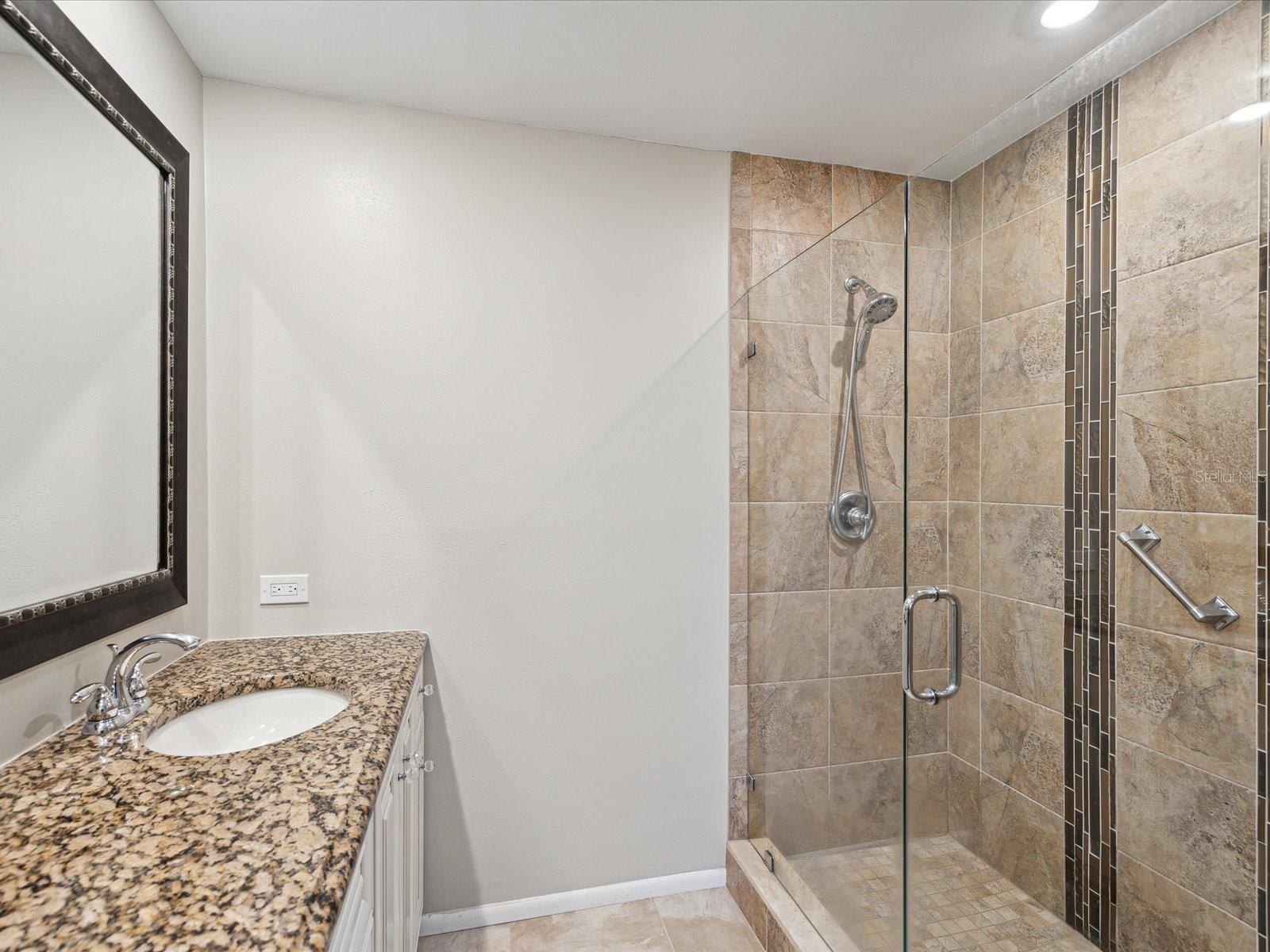 Master bathroom with walk in frameless shower