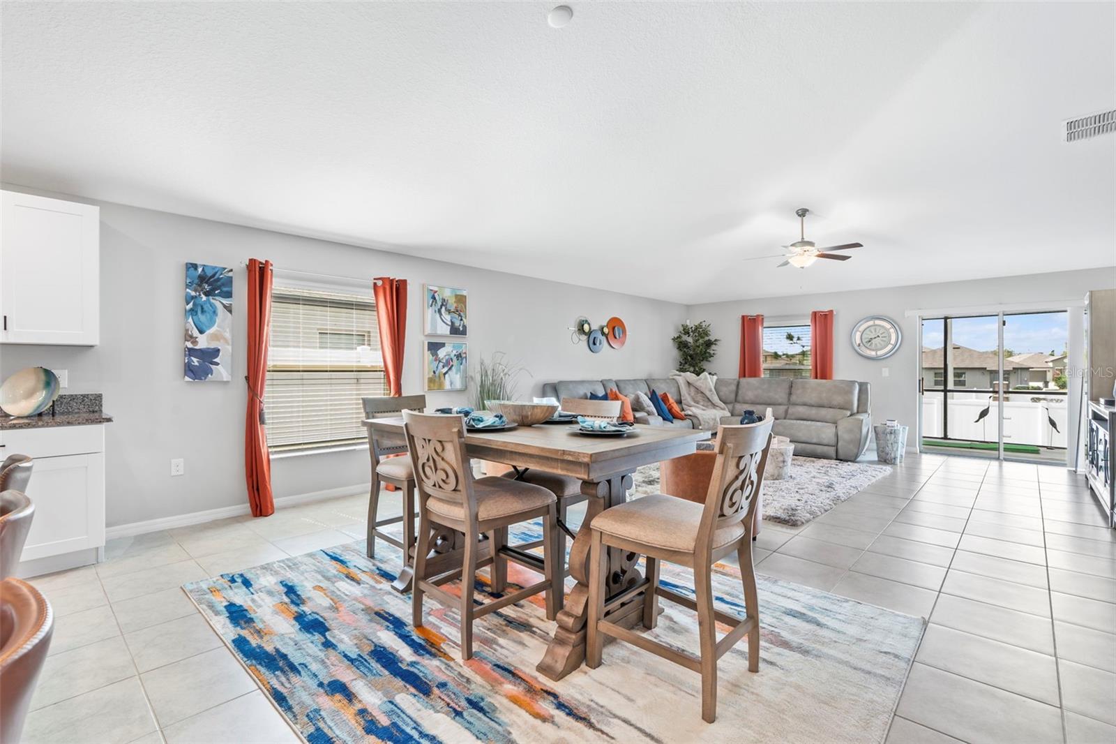 Kitchen overlooks dining area which flows into living room   13557 Willow Bluestar Lp, Riverview, FL 33579