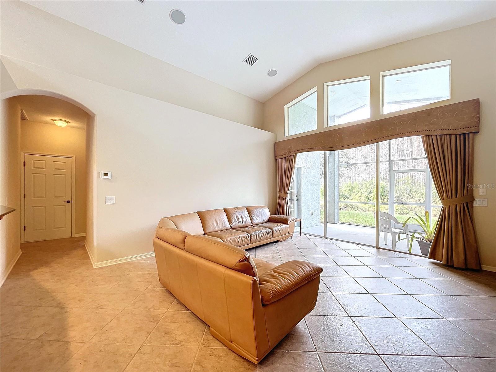 Family room has ceramic tile flooring for easy care