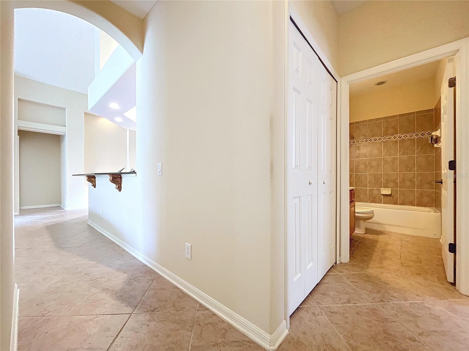 Hallway from the family room leads to bedrooms