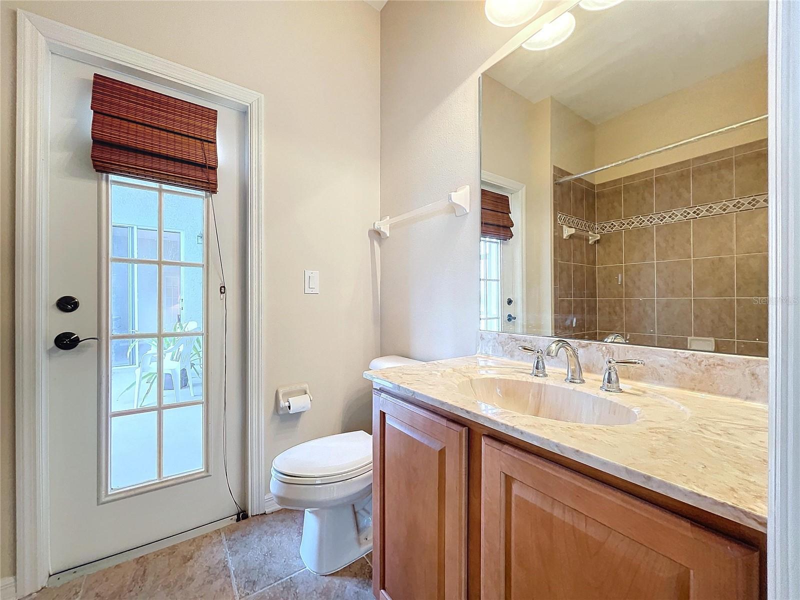 Full bath with convenience with outside