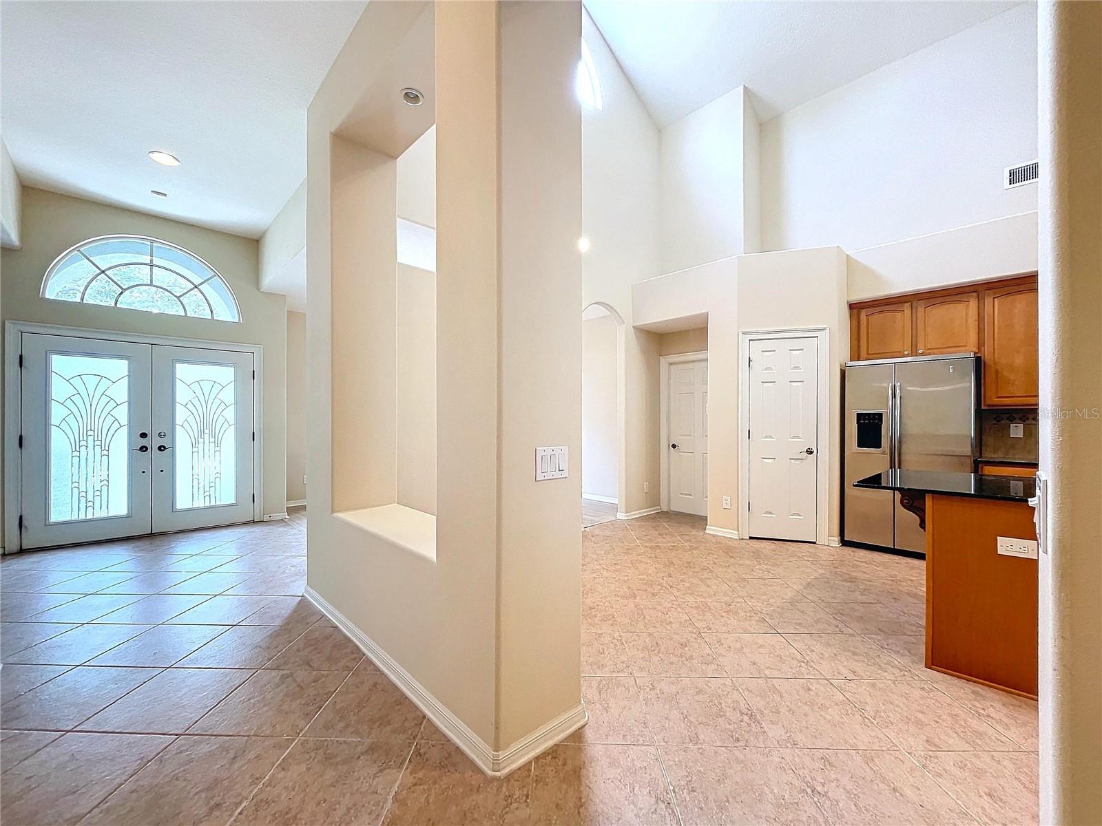 Entrance hall leads to kitchen