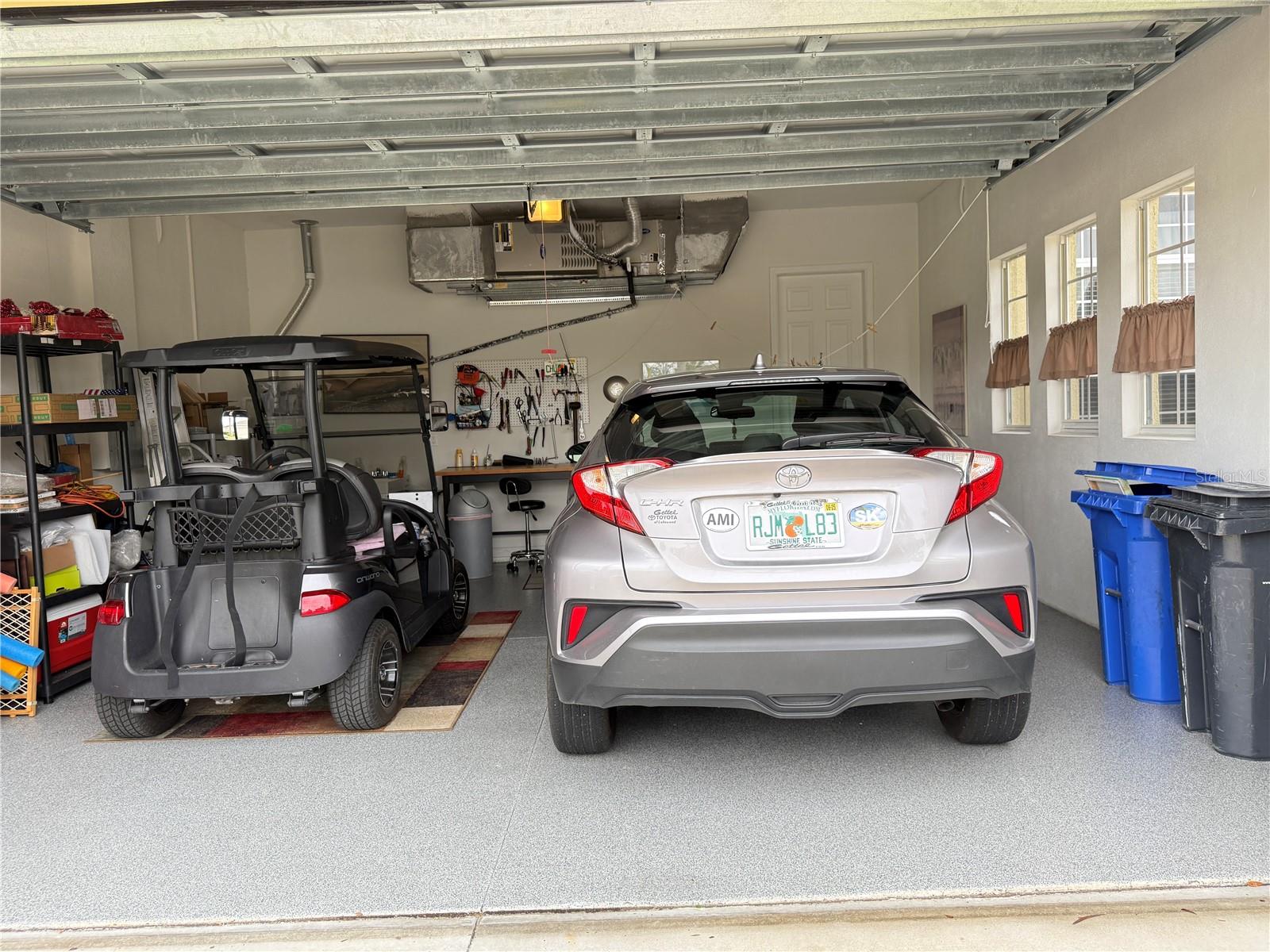 2 car garage with brand new epoxy flooring