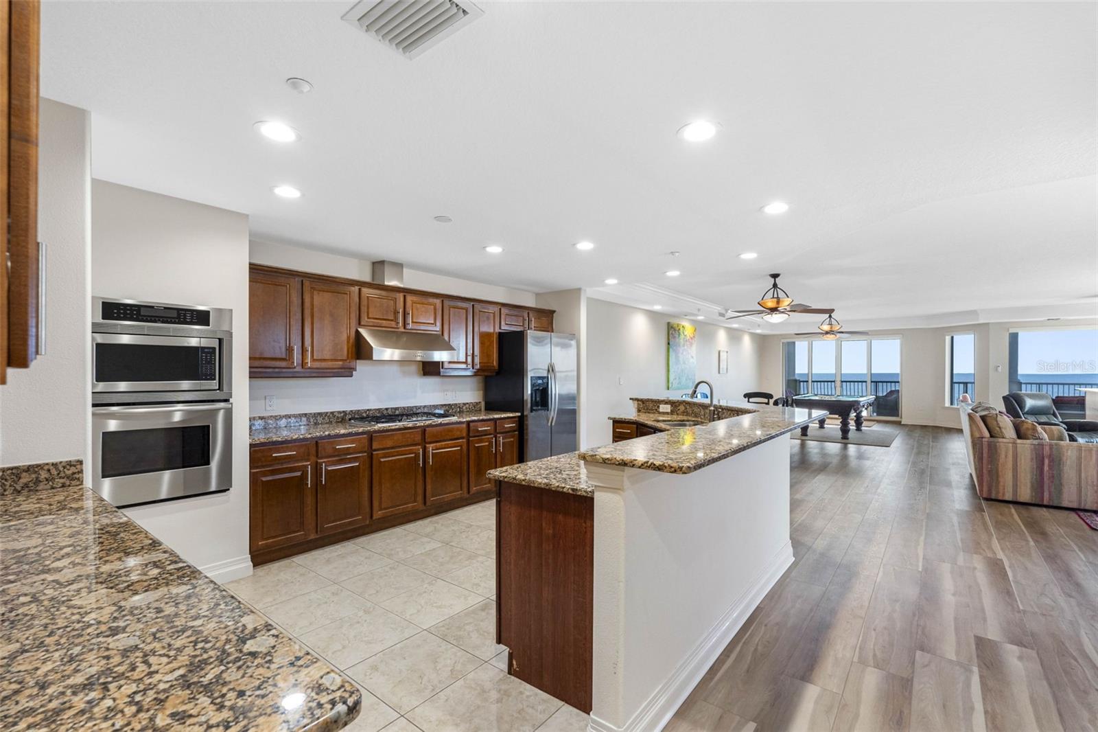 ..Great Room ( 41'x 27'  )  Shot Taking From North Side Looking Towards Beach. Perfect for a Large Extended Family. Kitchen on Left in Photo.