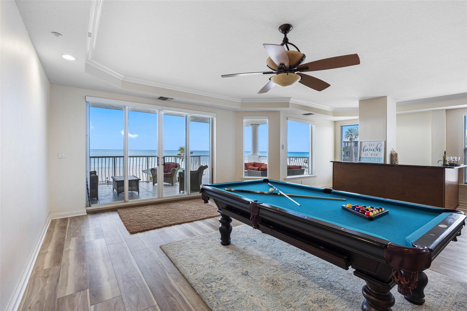 .. Northwest Corner - Convenient Wet Bar. Perfect Compliment to Pool Table or Balcony Entertaining.