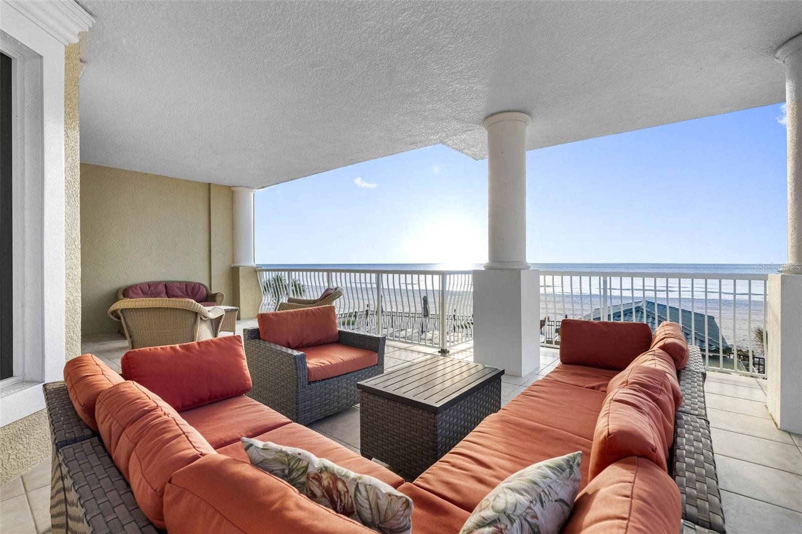 .....Balcony Shot Looking South. All Glass & Sliders Hurricane Rated. This is a Large Balcony - Perfect for Entertaining or Lounging at the Beach.