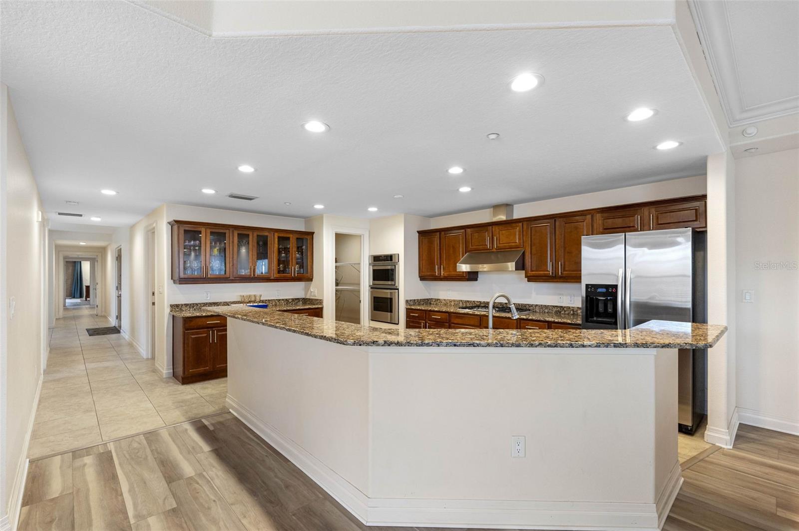 .. 12' x 17' Kitchen - High End Solid Wood Cabinetry. Walk in  Pantry Room on Right.