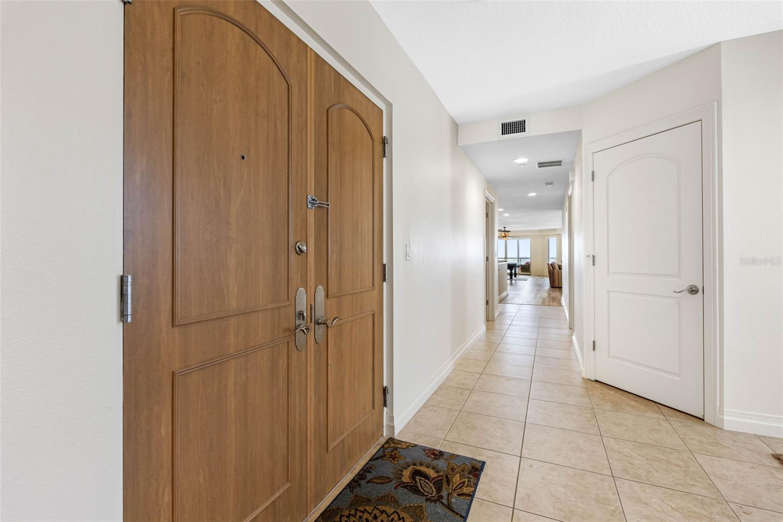 .. Inside Foyer .. 1/2 Bath Behind Two Panel Door.  A/C #2 Behind Double Doors. Another A/C in Laundry Room. Bedroom #4 - Fantastic Kitchen, Great Room and Living Areas to the Left and Master Retreat to the Right ..