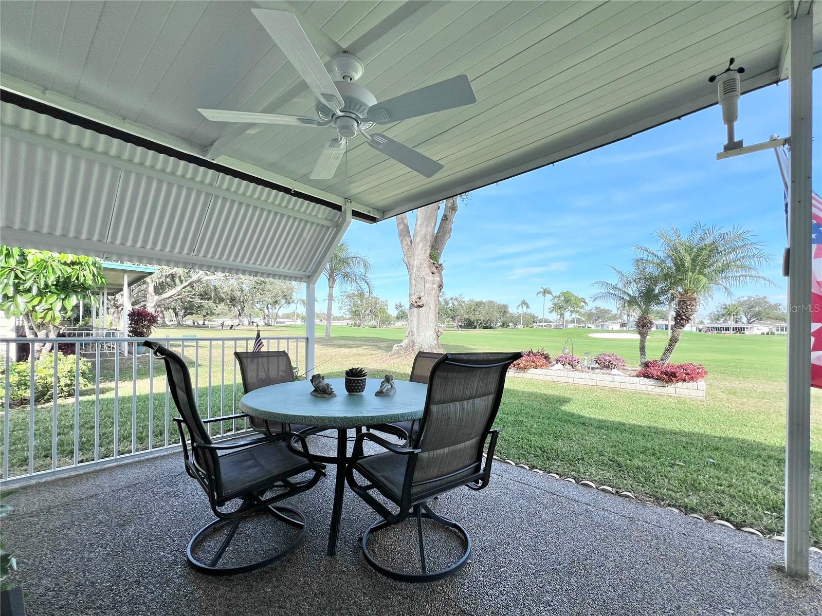 Back covered patio overlooking the golf course