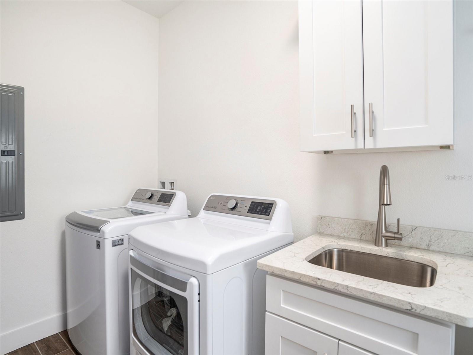 Separate laundry room off kitchen