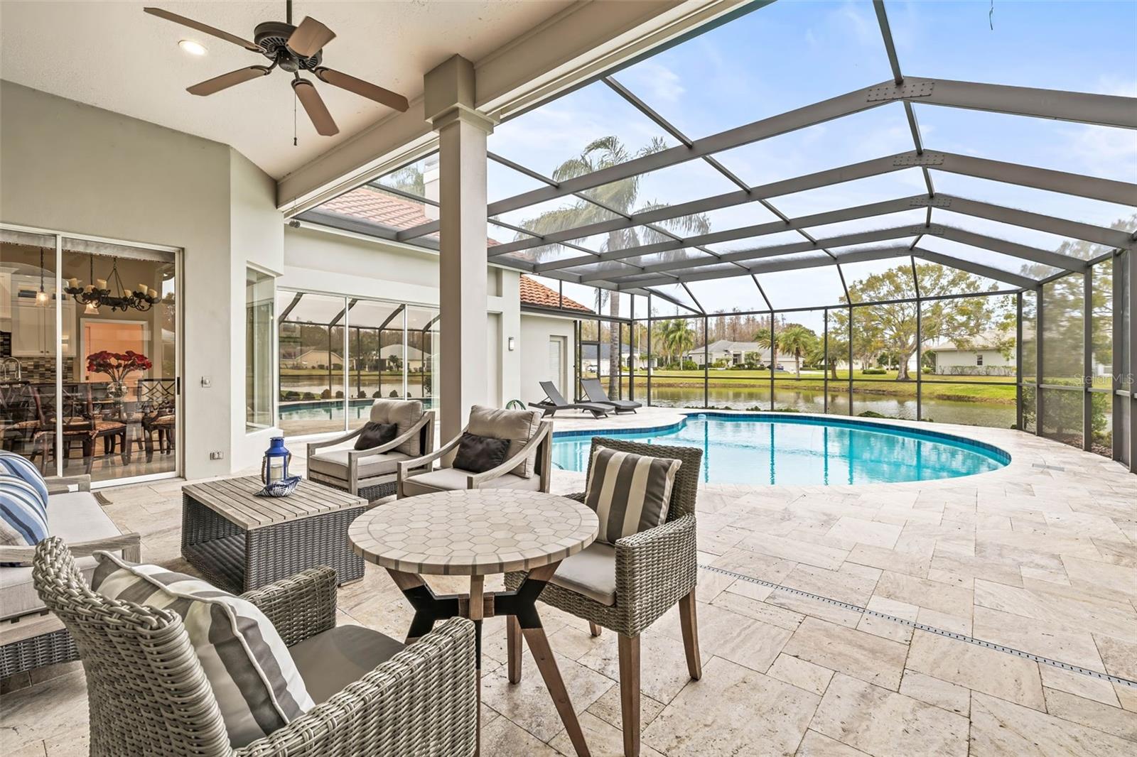 Saltwater pool with travertine pavers and NEW screen