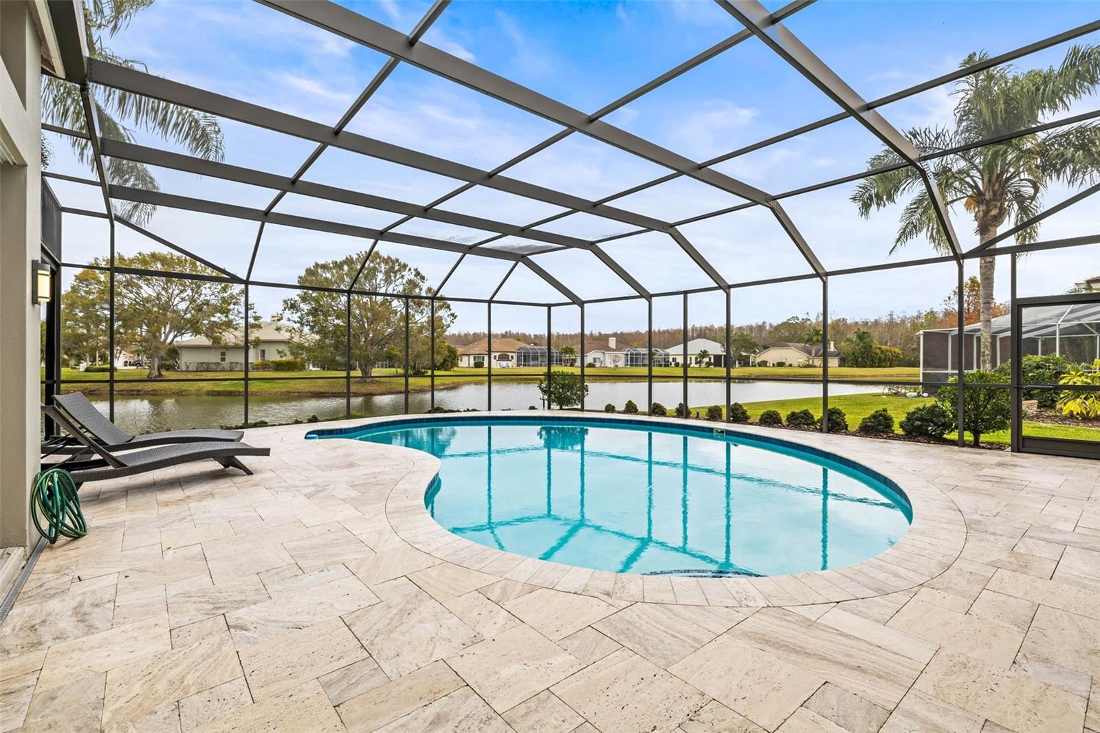 Saltwater pool with travertine pavers and NEW screen