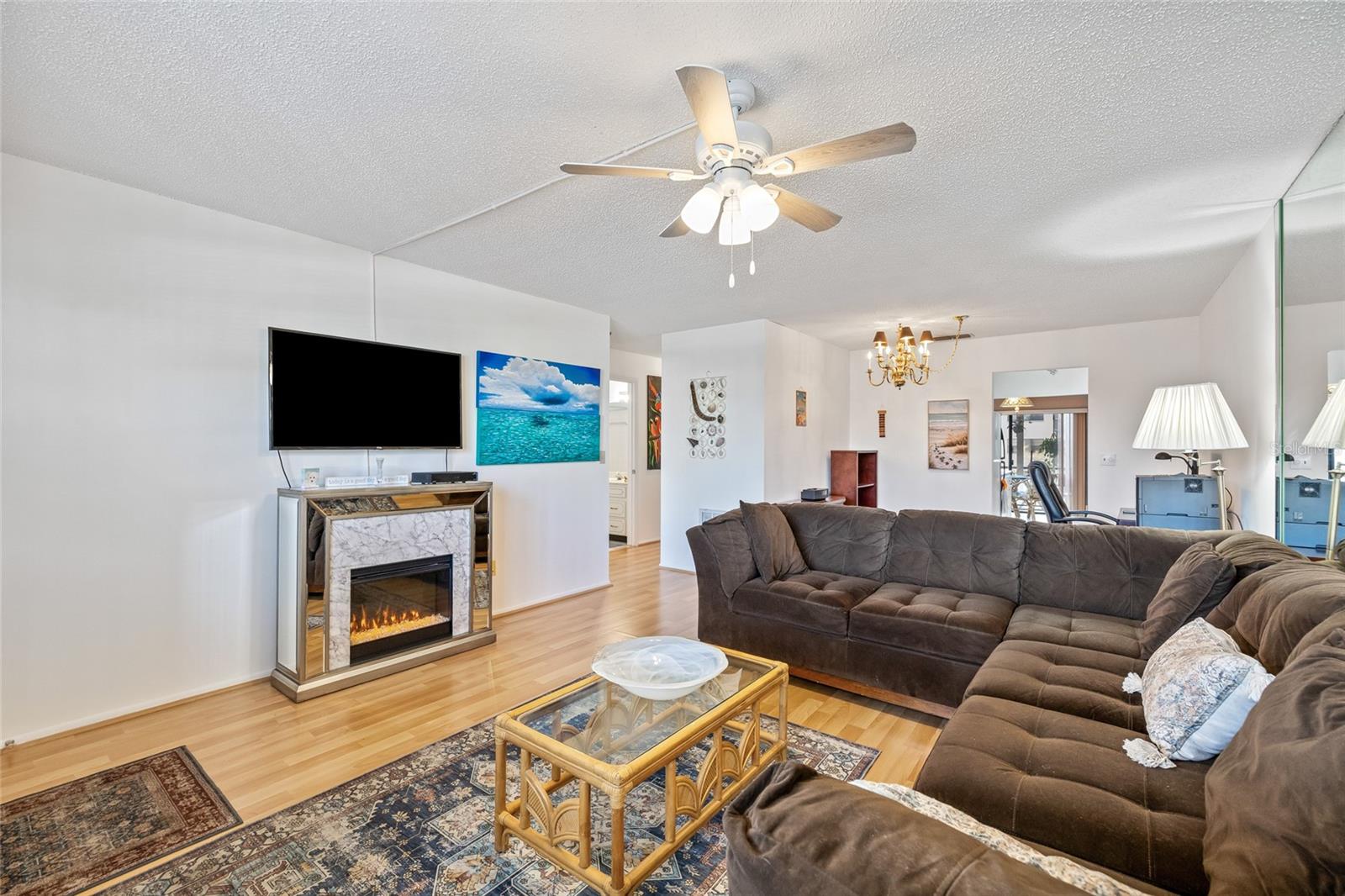 Living area with an electric fireplace.