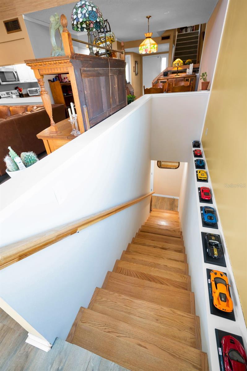 Descending down new indoor staircase to Bonus Room (not included in the square footage.)