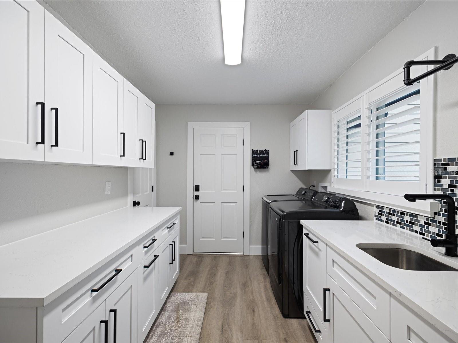 Laundry suite with access to garage