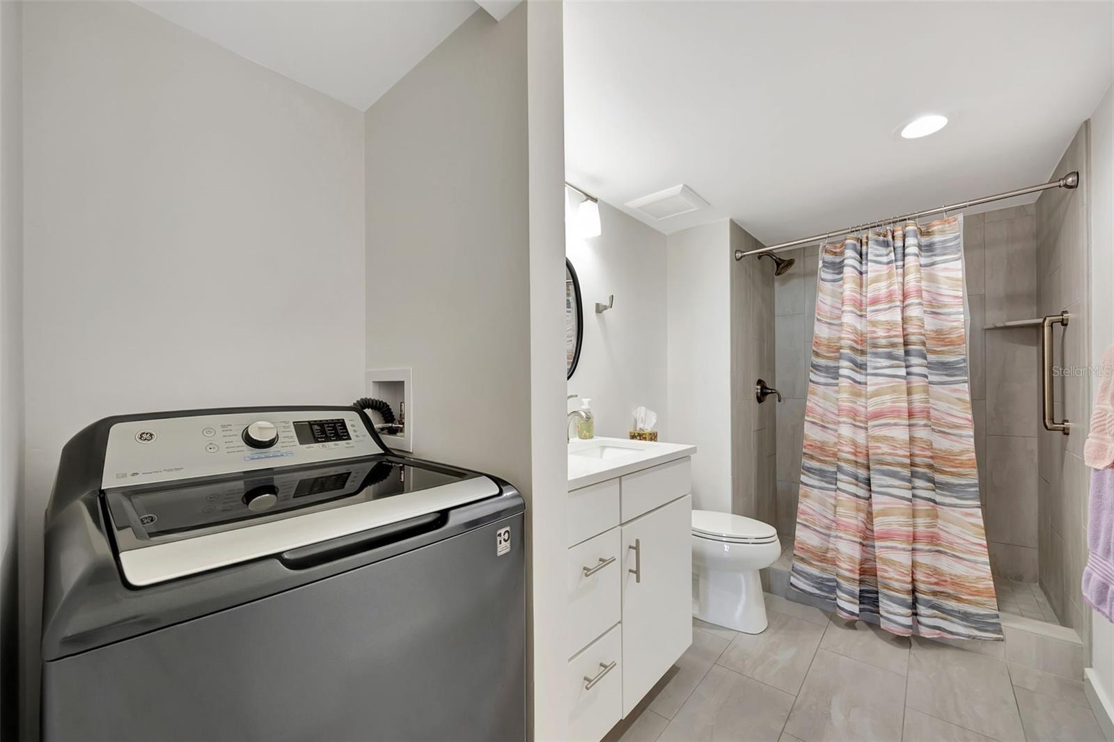 The second bath has a walkin shower with a Laundry area.