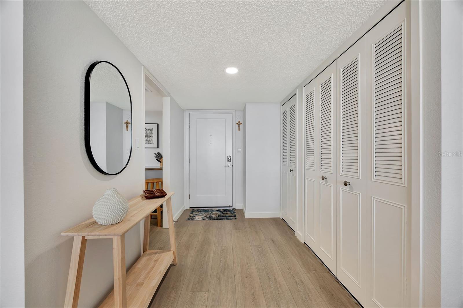 Lovely entry to the home with entrance to kitchen and lots of closets.