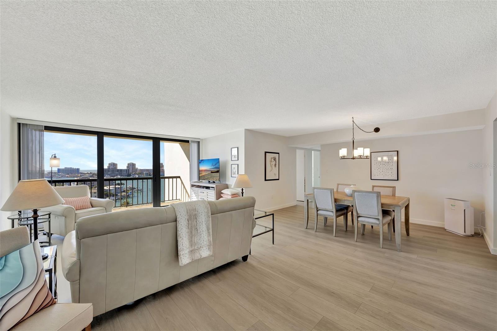 The living room and dining area of open and bright and makes easy entertaining.