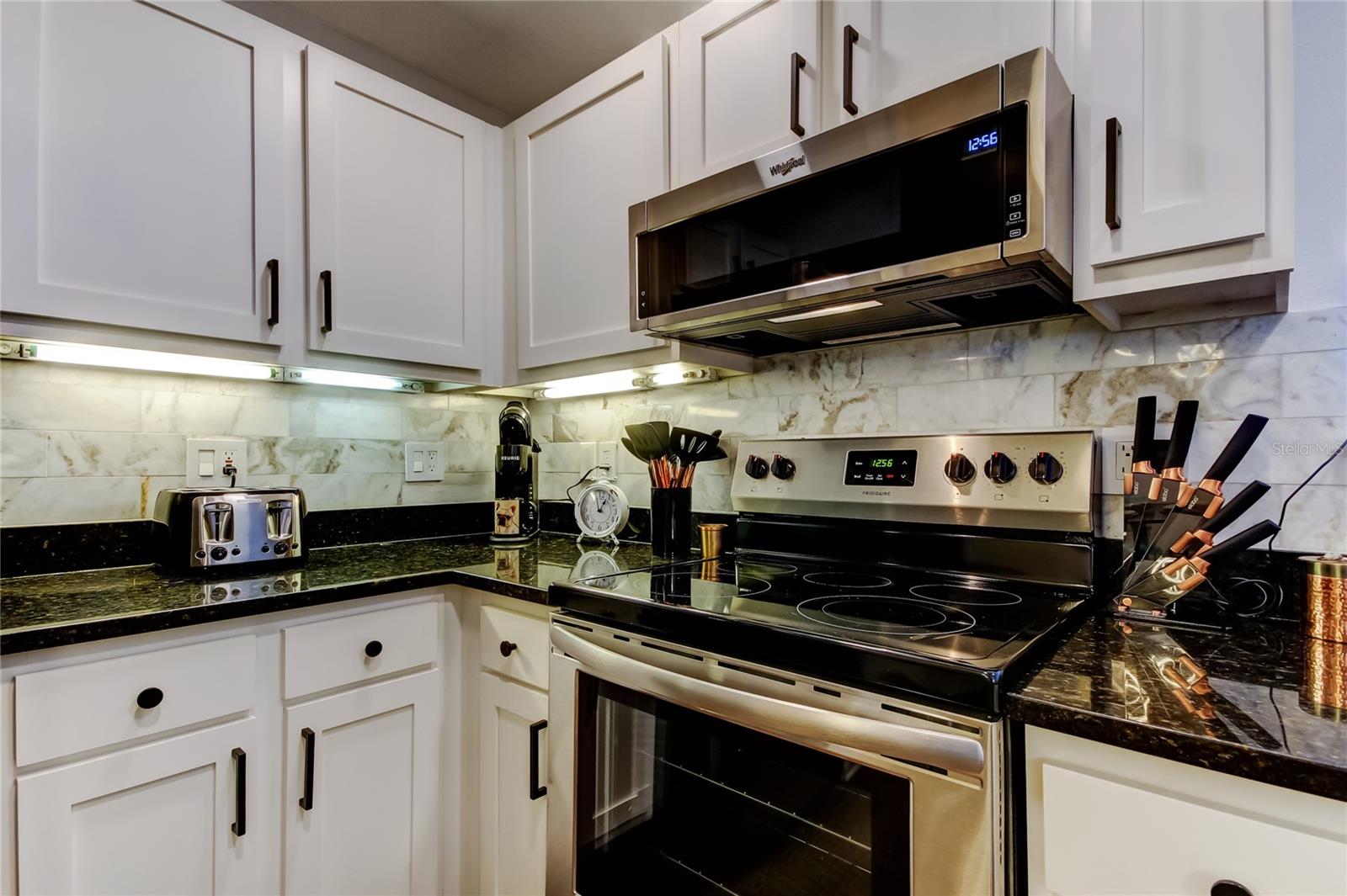 38. Updated Kitchen (7.9' x10.2') w/ Shaker Cabs, Granite Counters, Under Cab Lights, New Stainless Appliances, Marble Backsplash..