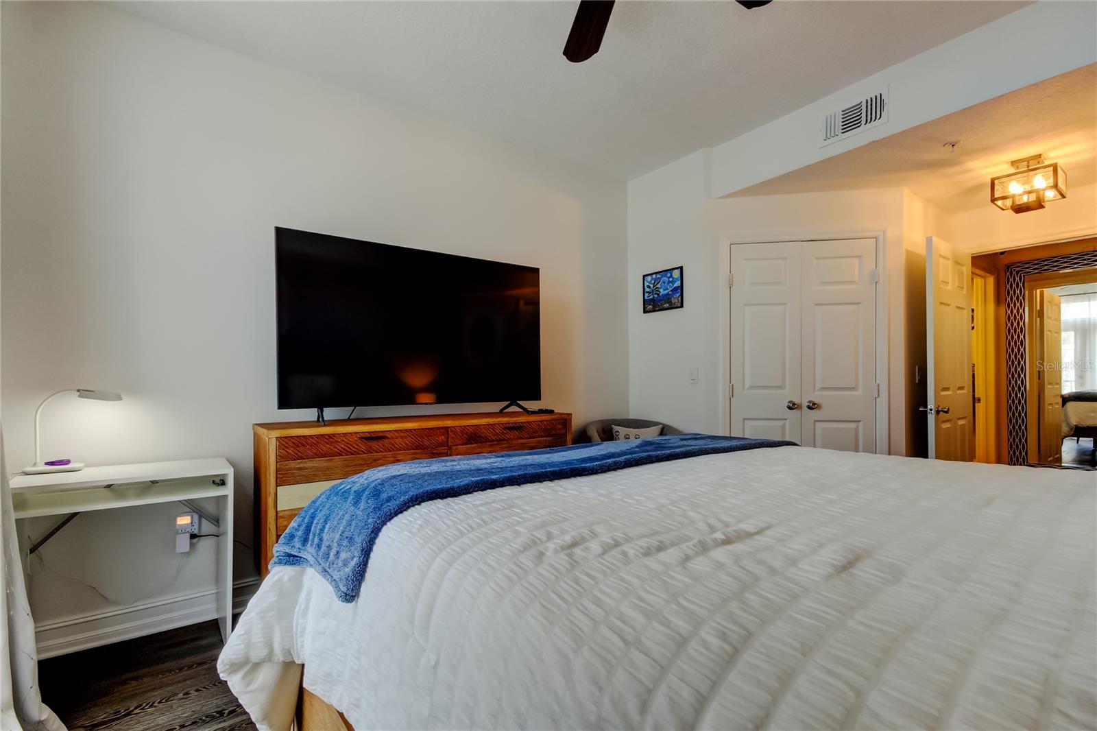 50. Owners Retreat Bedroom (18.7' x 12') - Queen Size Bedding with All the Comforts! End Tables, Dresser, & a Desk!