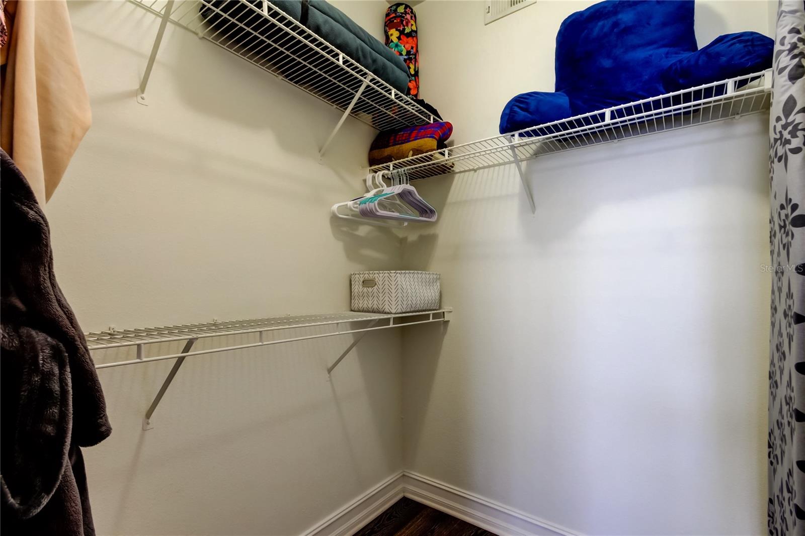 51. Owners Retreat Walk in Closet (5.8' x 4.11') is Super Spacious with Multiple Shelves Built In for YOU!