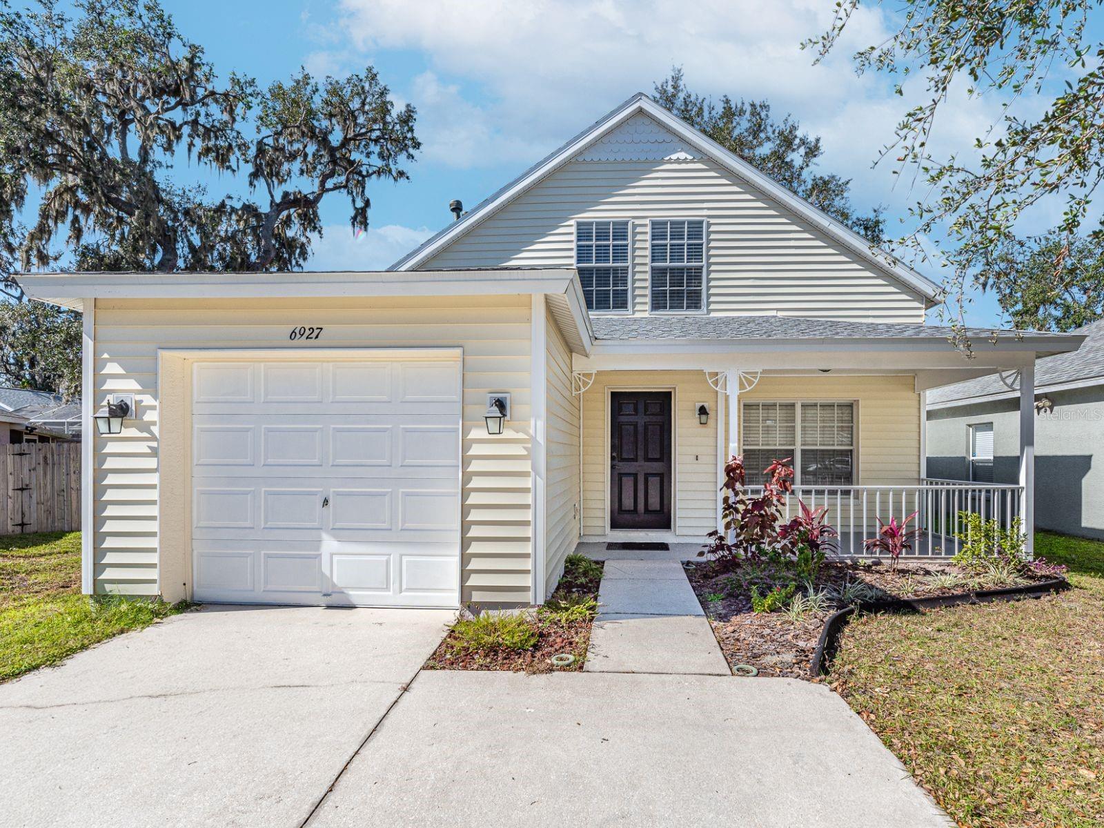 4-bedroom, 2-bath home boasts a welcoming front porch.