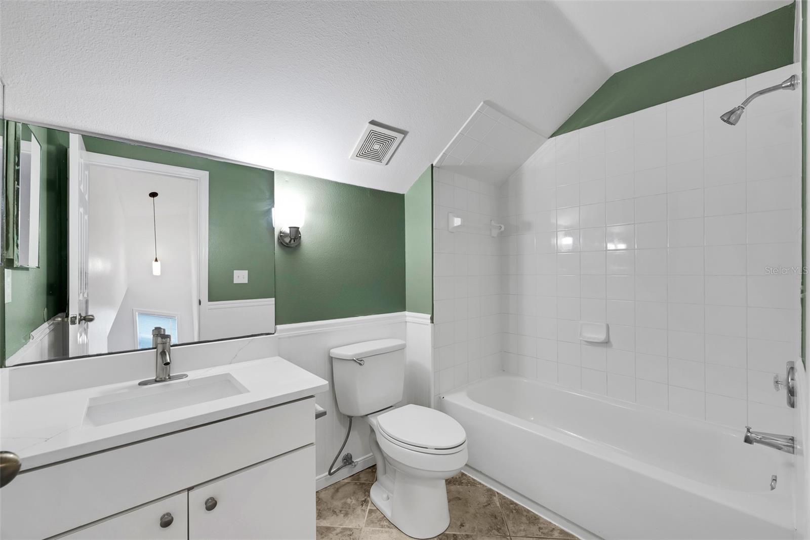 Bathroom #2 upstairs has an upgraded vanity with granite and stylish fixtures and has a shower/bath combination.