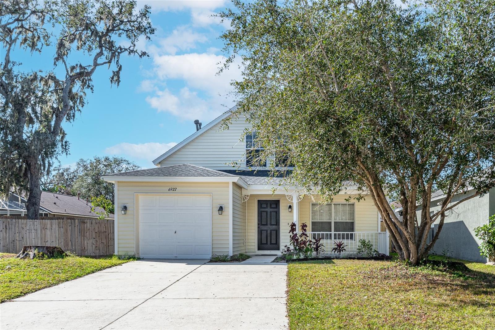 Charming two-story home nestled on a quiet cul-de-sac in a peaceful neighborhood boasts a welcoming front porch