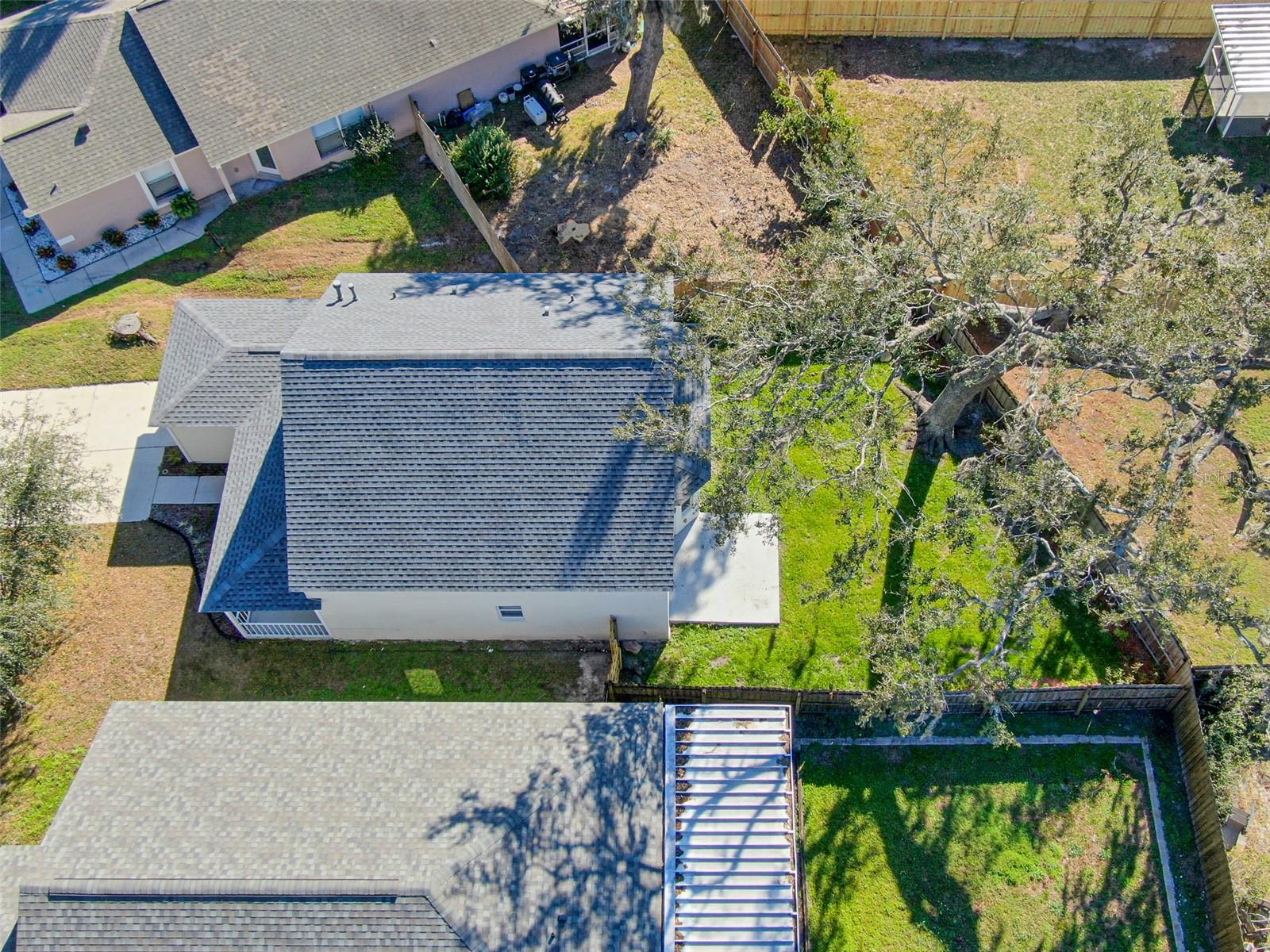 Aerial view of property and newer roof replaced in 2022.