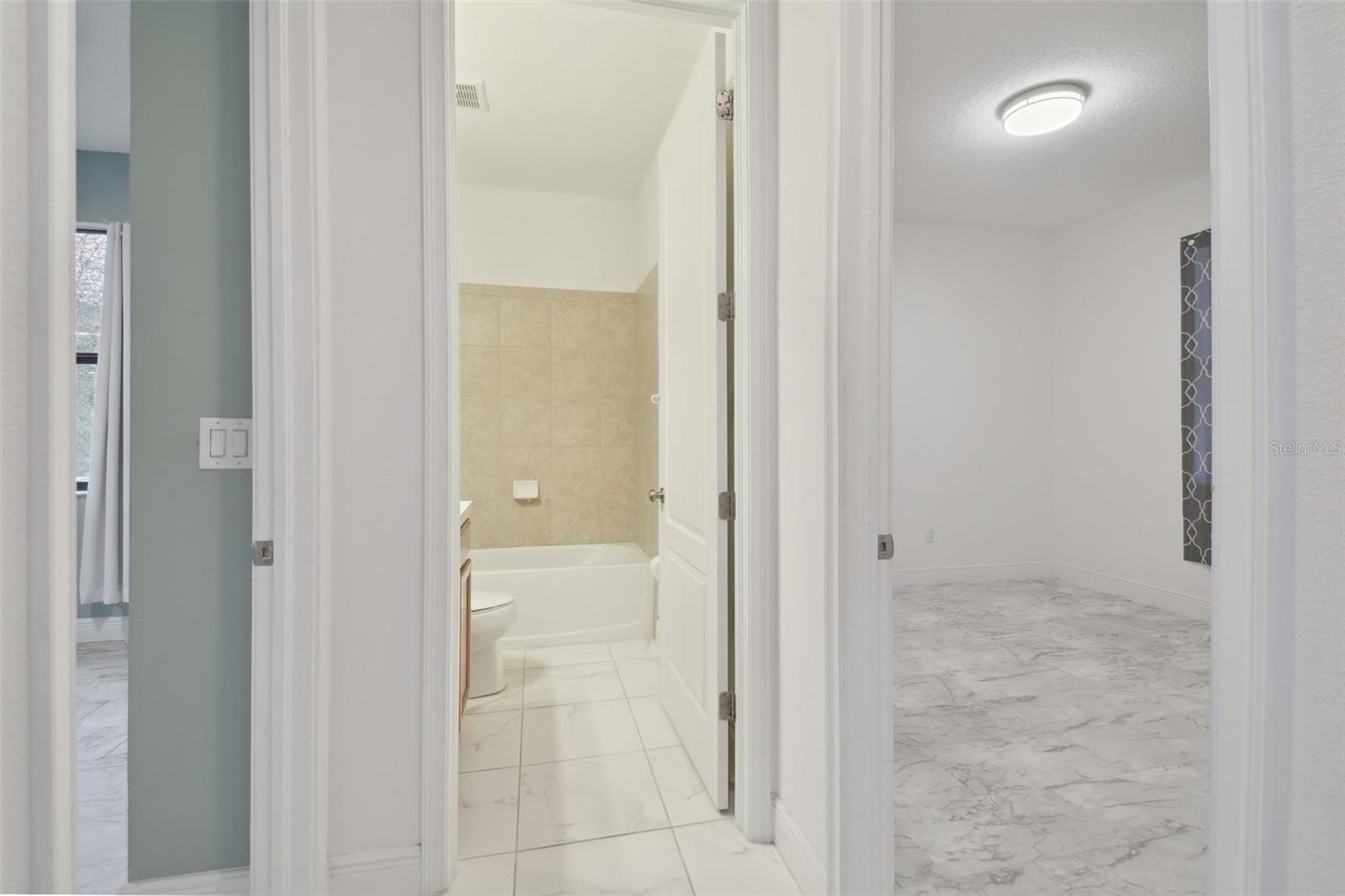 Secondary bathroom adjacent to the secondary bedrooms.