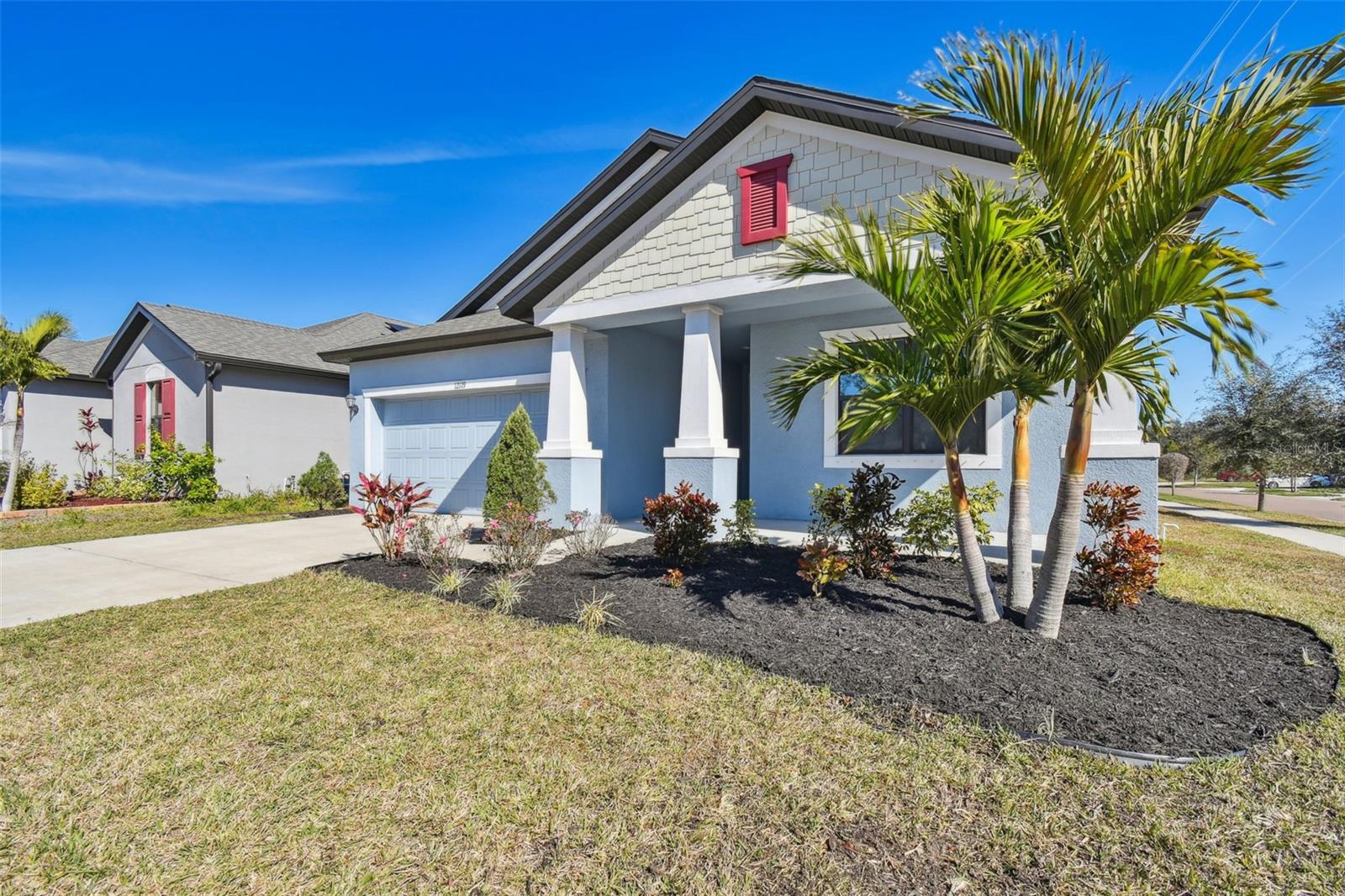 View from the Southwest side of the home with updated landscaping.