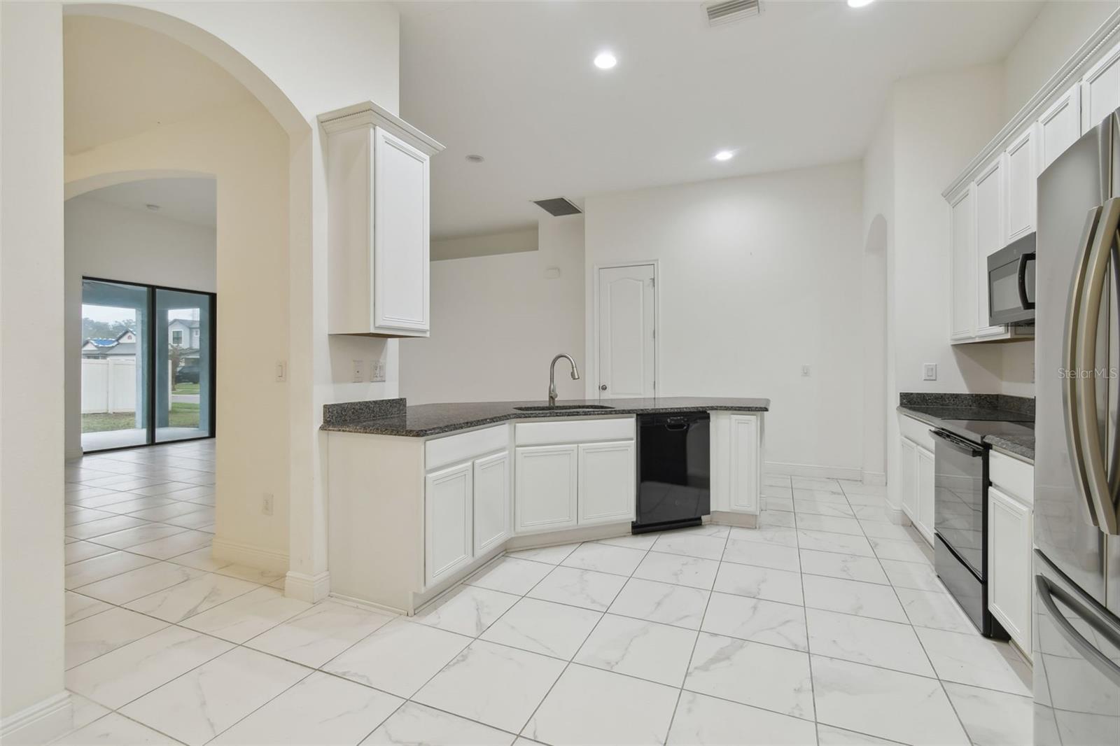 Kitchen view with plenty of cabinetry space.