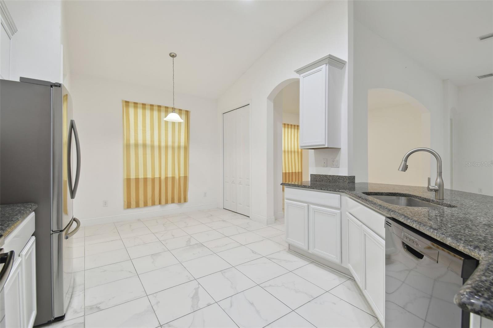 Open kitchen with breakfast nook.