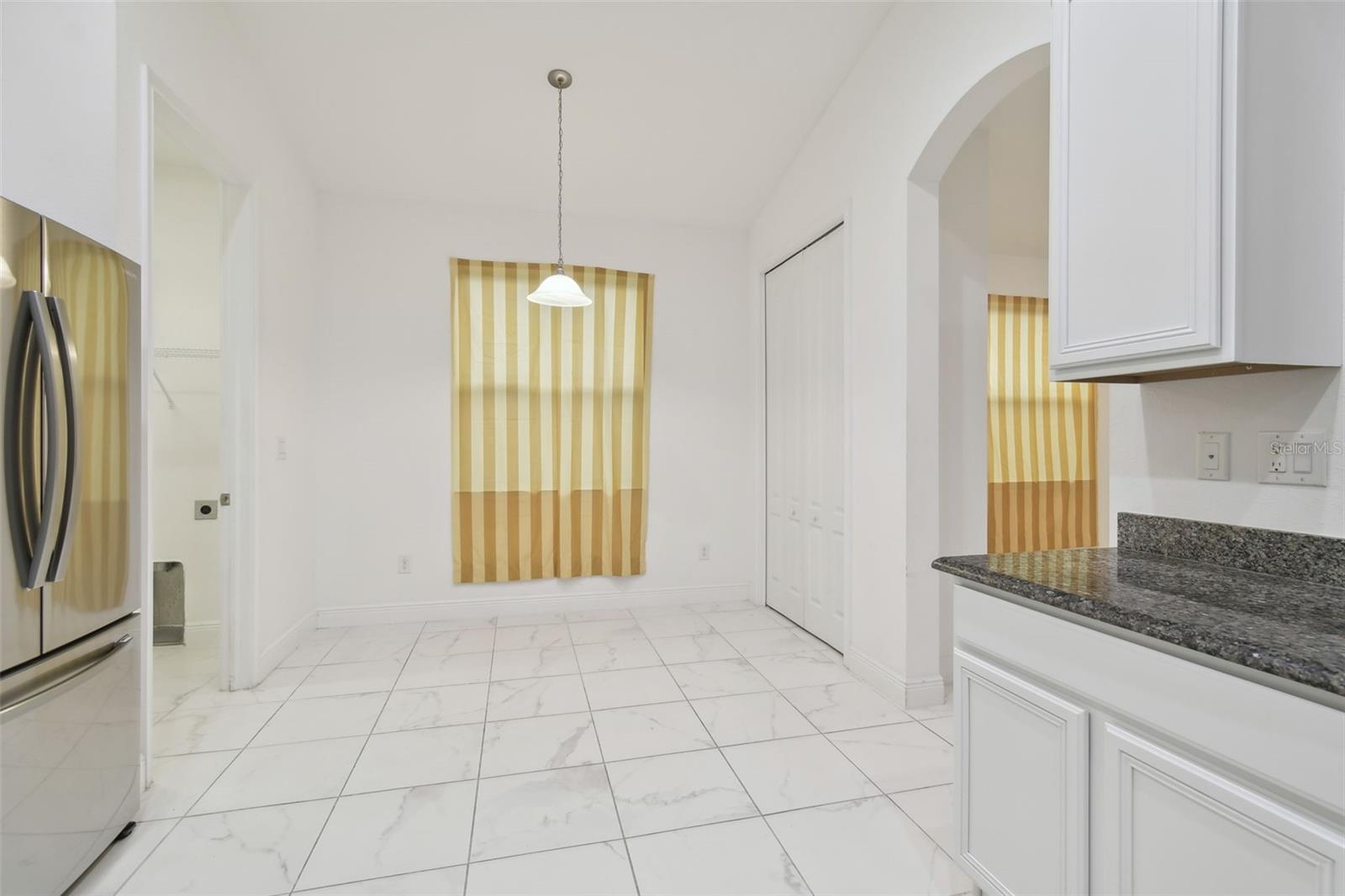 View of the breakfast nook area and large pantry.