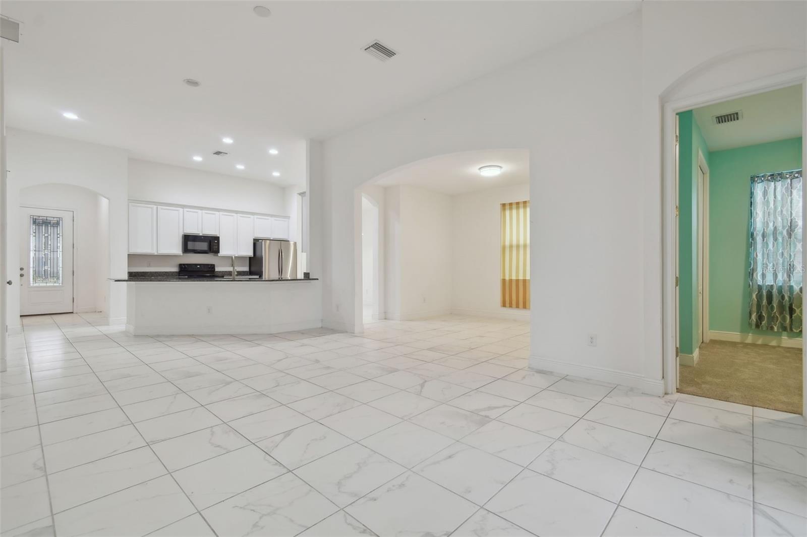 View from the living area towards Bedroom 4 and dining area.