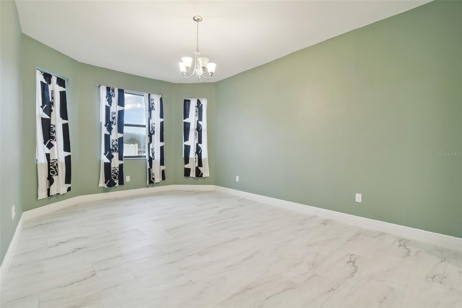 Large master suite with bay windows.