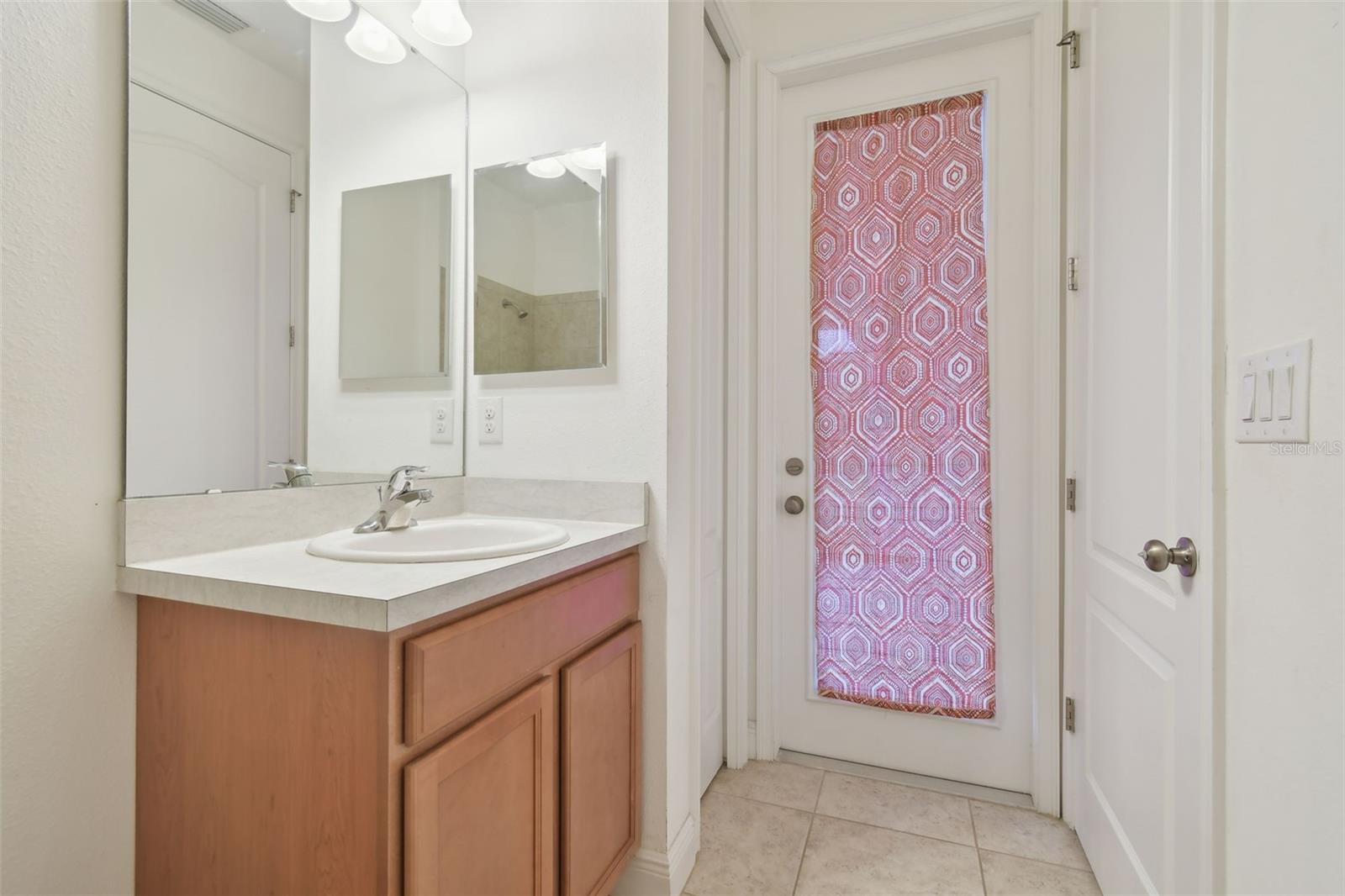 Bedroom 4 ensuite with storage closet and access out to the lanai.