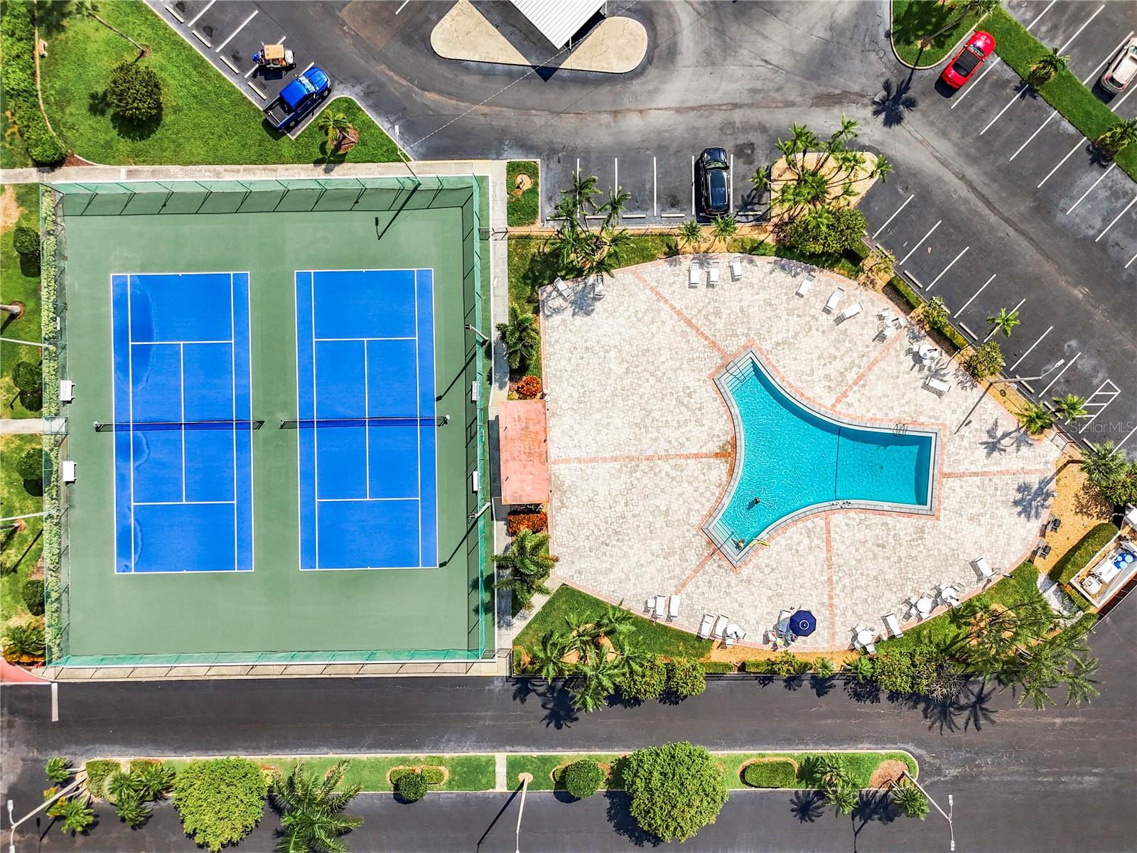 Aerial view of one of the 6 heated pools and tennis/pickleball courts