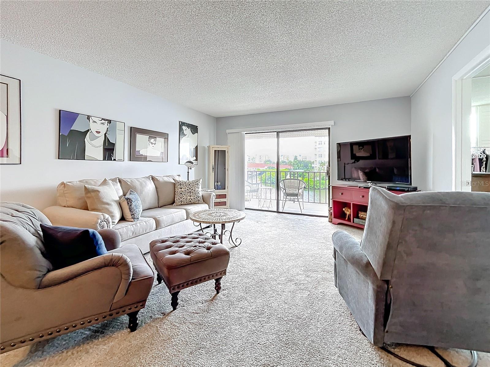 This unit has a breakfast bar overlooking the dining area