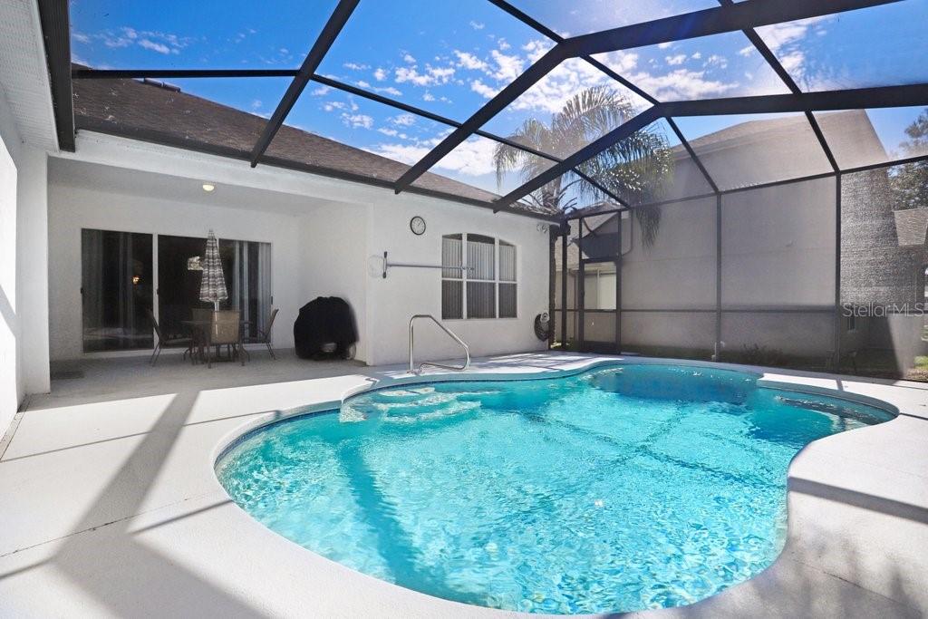 Pool with pebble tech and if and if you love the gators blue and orange tile on the steps