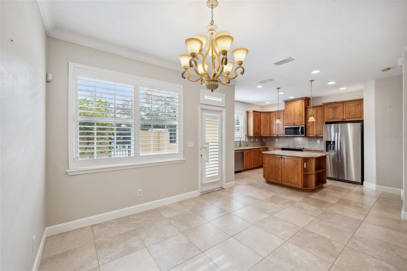 Dining Area with plenty of natural light and shutters on every window and door!