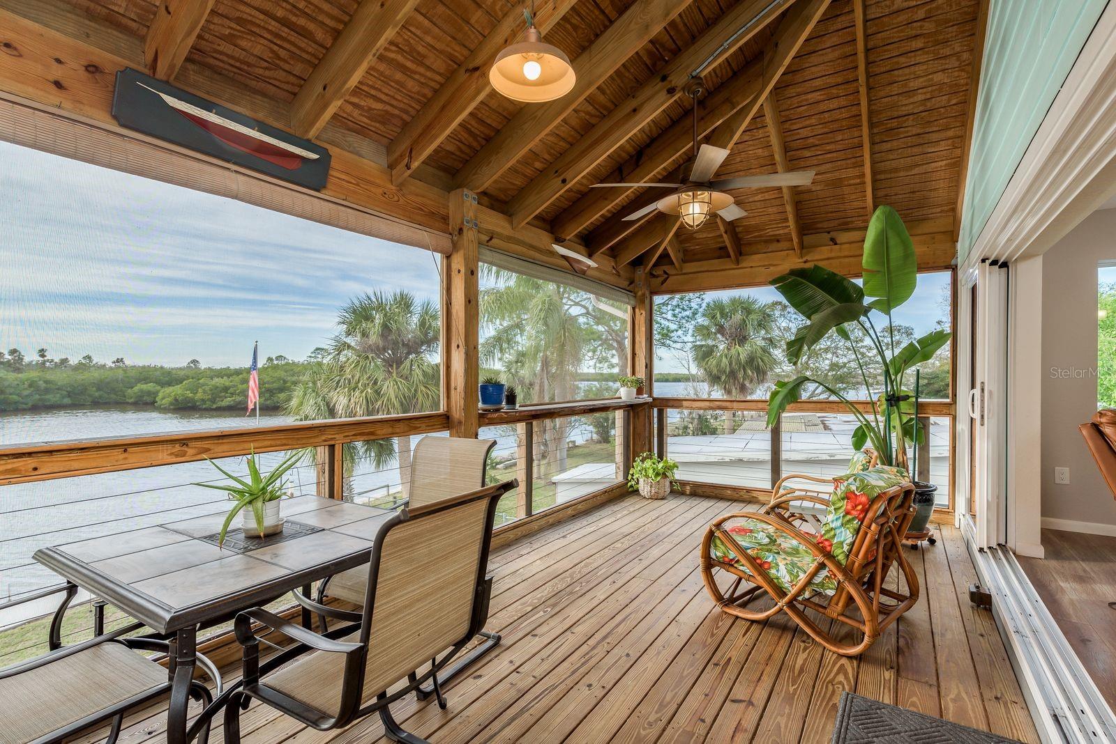 Show stopping back porch fully screened and reinforced for complete enclosure if buyer prefers to add more living space