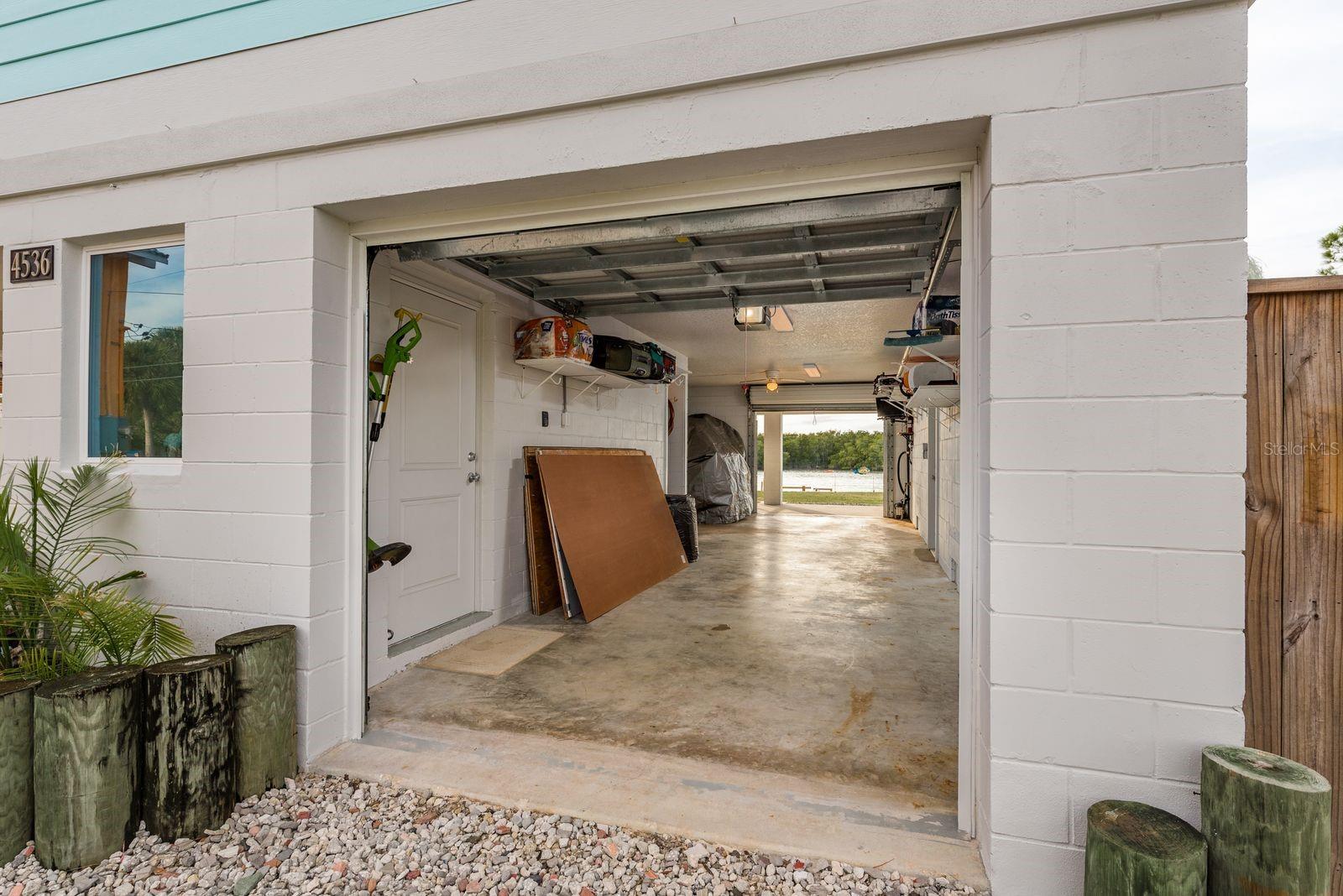 Enclosed garage with workshop on first level