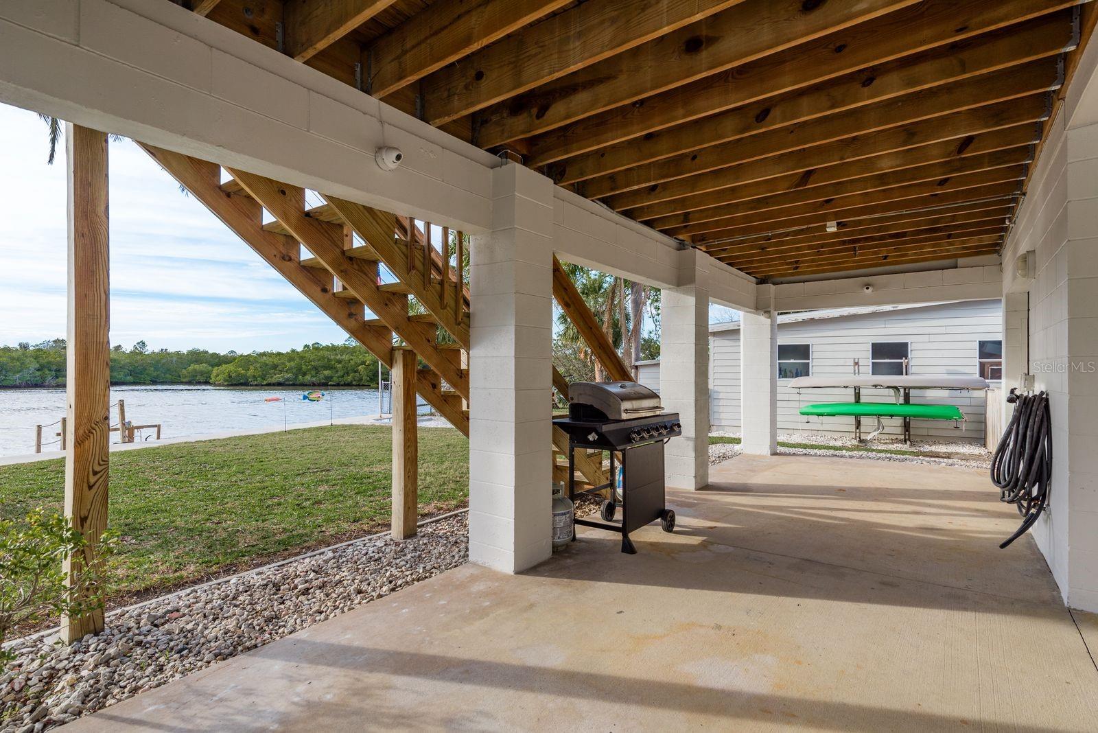 Enjoy outdoor shade and water views while you make dinner on the grill