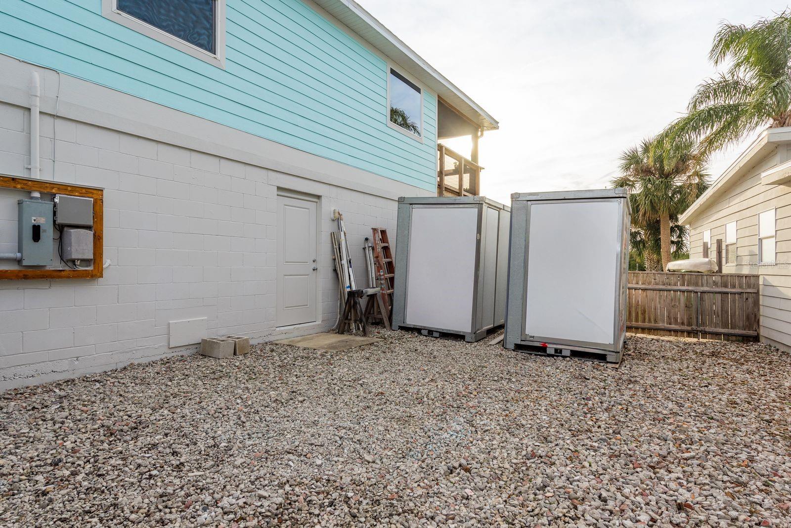 Graveled parking and hook up for RV. Storage containers will relocate with sellers