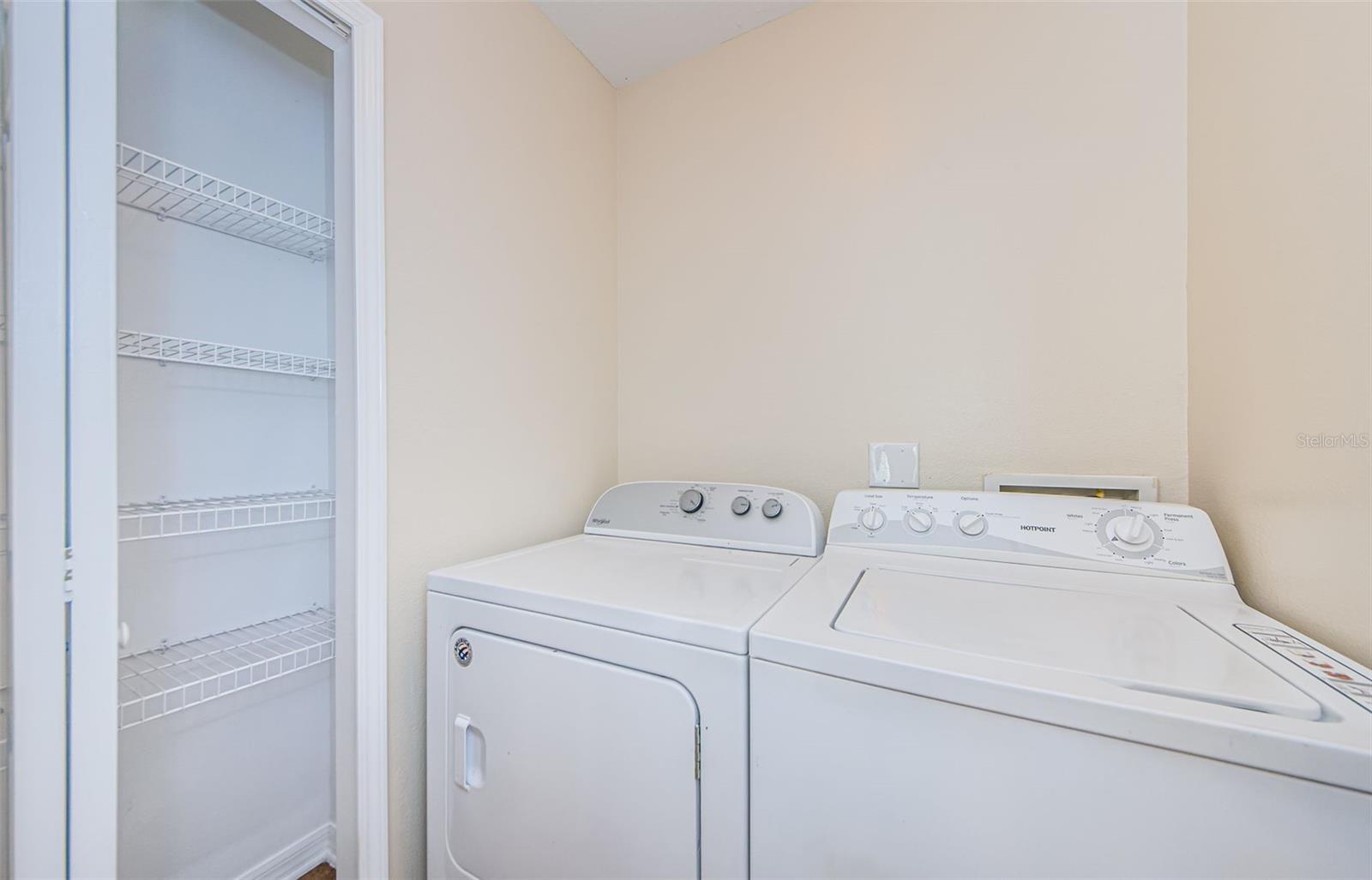 Laundry area inside off of garage.