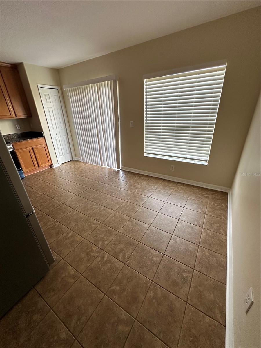 View From Entrance to Kitchen. Large Window and Sliding Glass Door to Backyard