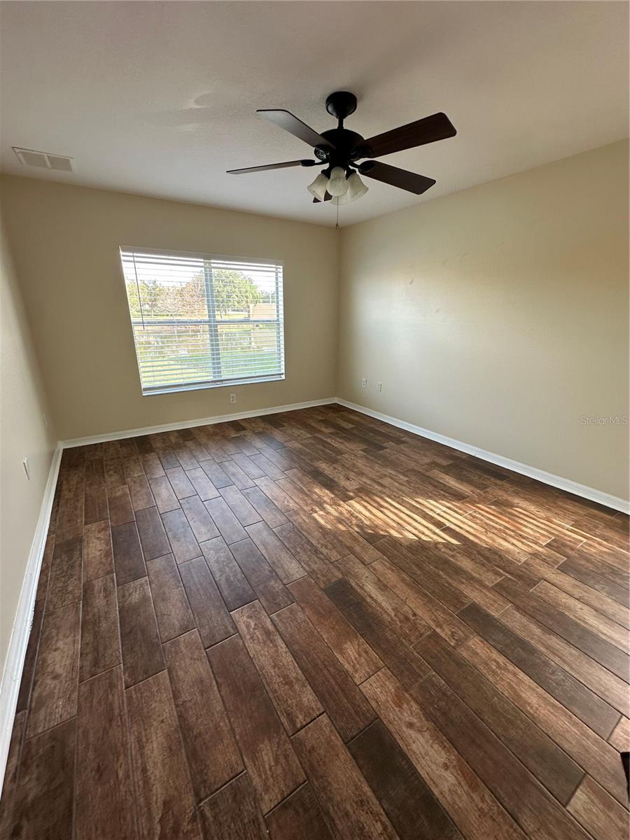 Master Bedroom. Large Window and Ceramic Tile Floor