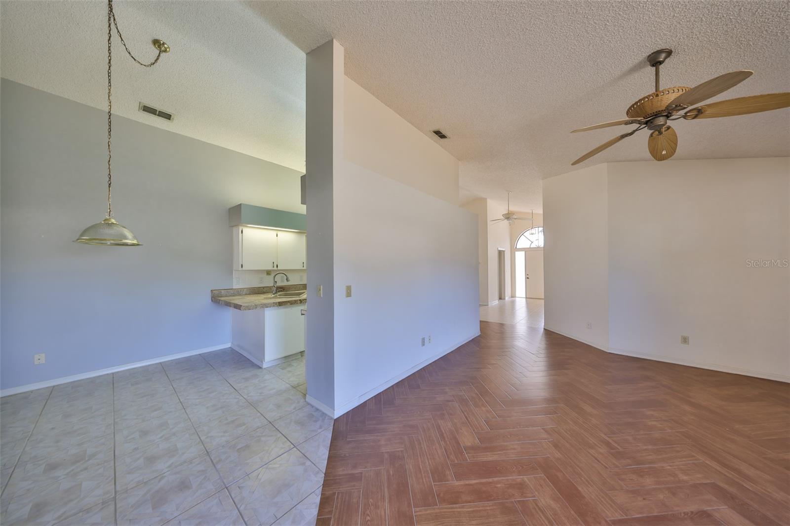 LIVING ROOM TO EATING AREA AND KITCHEN