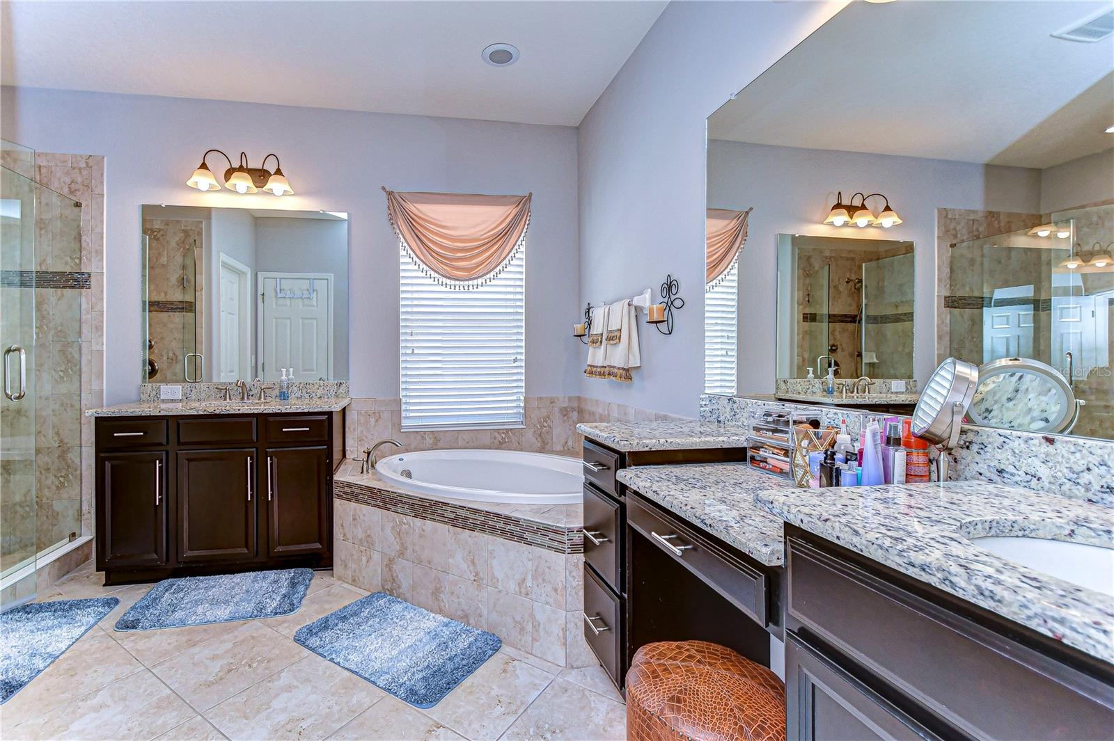 Primary bathroom with luxurious dual vanities.